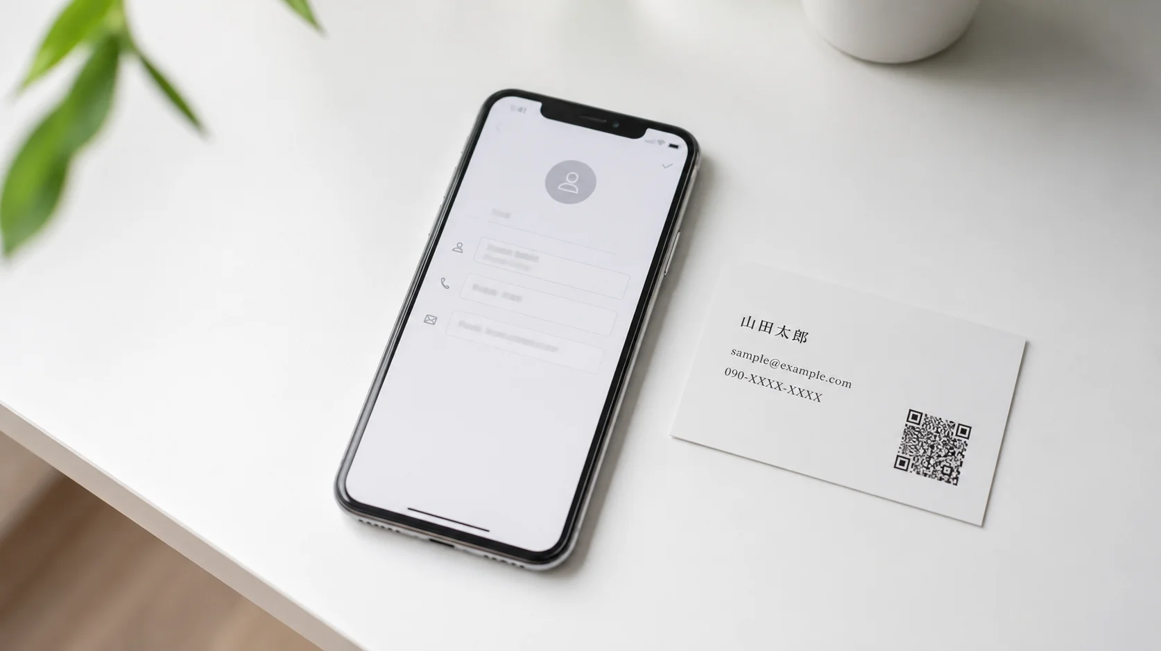 スマホの連絡先アプリにQRコードから登録する様子